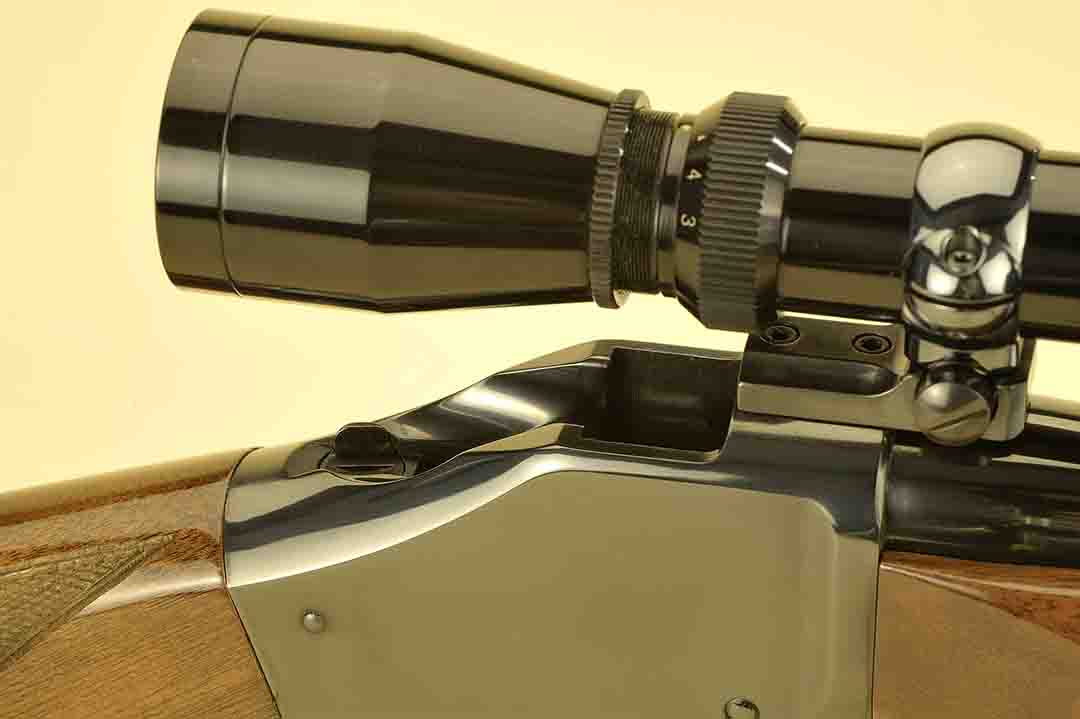 With the lever completely down, everything disappears into the receiver. With the falling block out of sight, it is easy to charge the gun with a fresh round.